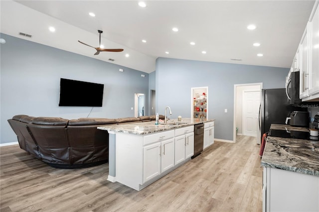 3883 Sandhill Crane Dr, Lakeland, FL 33811 - kitchen with a sink, ceiling fan, appliances with stainless steel finishes, a kitchen island with sink, and white cabinetry