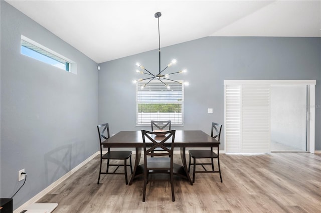 3883 Sandhill Crane Dr, Lakeland, FL 33811 - dining room with light wood-type flooring, a chandelier, healthy amount of natural light, and high vaulted ceiling