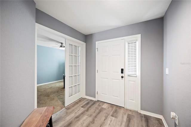3883 Sandhill Crane Dr, Lakeland, FL 33811 - foyer entrance featuring baseboards, light wood-style flooring, and ceiling fan