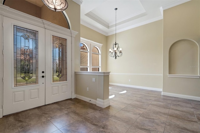 6527 Eagle Ridge Way, Lakeland, FL 33813 - entrance foyer with a chandelier, crown molding, a raised ceiling, a high ceiling, and french doors