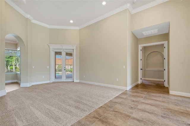 6527 Eagle Ridge Way, Lakeland, FL 33813 - spare room featuring arched walkways, ornamental molding, a high ceiling, and recessed lighting