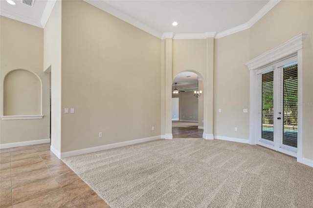 6527 Eagle Ridge Way, Lakeland, FL 33813 - spare room featuring ornamental molding, a towering ceiling, a ceiling fan, french doors, and arched walkways