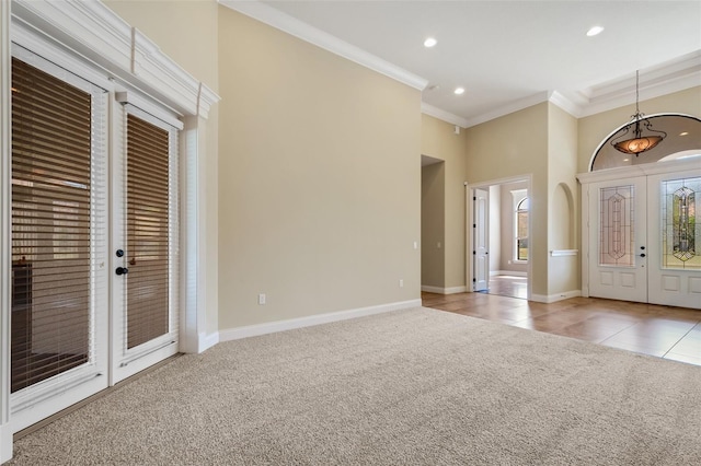 6527 Eagle Ridge Way, Lakeland, FL 33813 - entryway featuring french doors, ornamental molding, light carpet, recessed lighting, and light tile patterned flooring