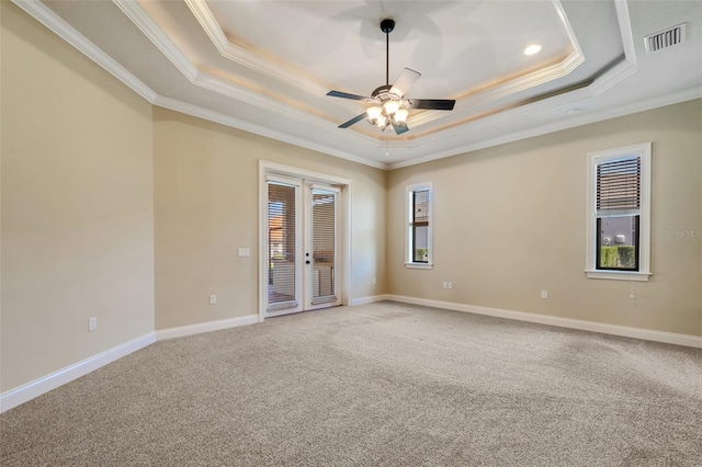 6527 Eagle Ridge Way, Lakeland, FL 33813 - empty room featuring a raised ceiling, crown molding, carpet, ceiling fan, and french doors