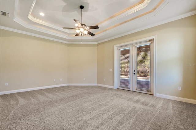 6527 Eagle Ridge Way, Lakeland, FL 33813 - carpeted spare room featuring crown molding, a tray ceiling, french doors, and ceiling fan