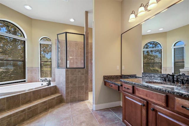 6527 Eagle Ridge Way, Lakeland, FL 33813 - full bath featuring tile patterned flooring, plenty of natural light, a tile shower, and a garden tub