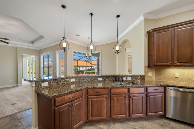 6527 Eagle Ridge Way, Lakeland, FL 33813 - kitchen with dishwasher, arched walkways, dark stone counters, hanging light fixtures, and ceiling fan
