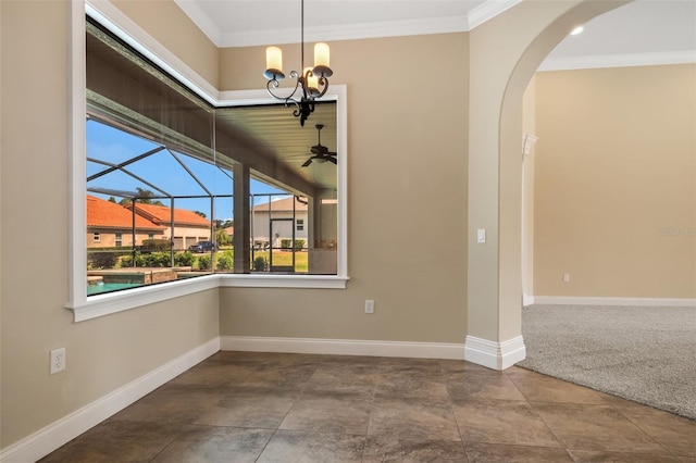6527 Eagle Ridge Way, Lakeland, FL 33813 - unfurnished dining area featuring arched walkways, ornamental molding, a chandelier, and a sunroom