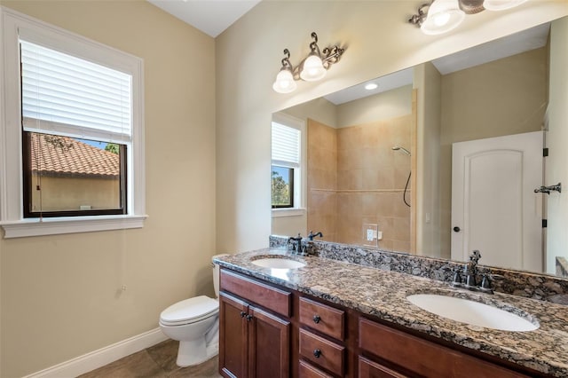 6527 Eagle Ridge Way, Lakeland, FL 33813 - full bathroom featuring double vanity, a tile shower, and plenty of natural light
