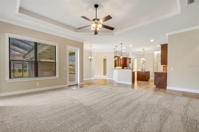 6527 Eagle Ridge Way, Lakeland, FL 33813 - unfurnished living room with a tray ceiling, crown molding, a ceiling fan, light carpet, and recessed lighting
