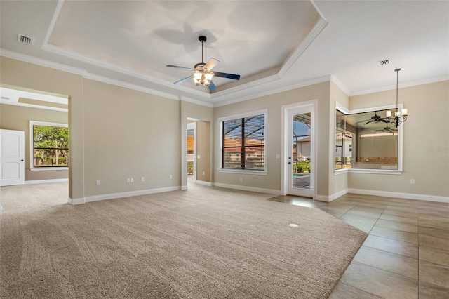 6527 Eagle Ridge Way, Lakeland, FL 33813 - tiled empty room featuring a raised ceiling, ceiling fan, a chandelier, and ornamental molding