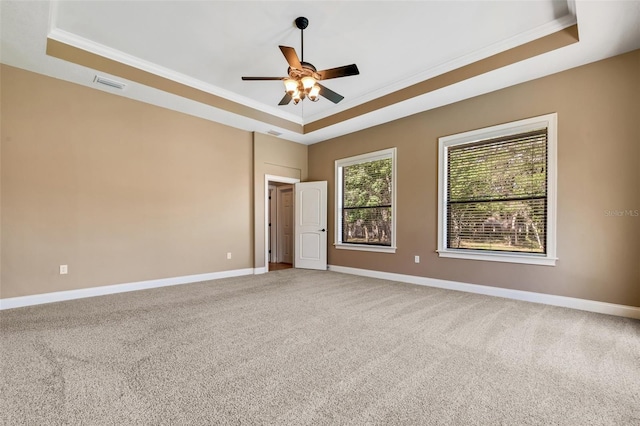6527 Eagle Ridge Way, Lakeland, FL 33813 - carpeted empty room with a tray ceiling, ornamental molding, and a ceiling fan