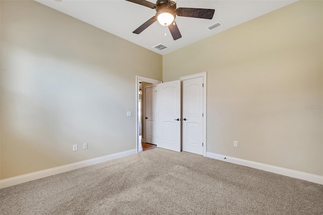 6527 Eagle Ridge Way, Lakeland, FL 33813 - carpeted empty room featuring a ceiling fan and a high ceiling