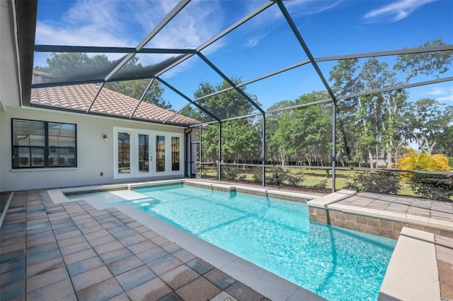 6527 Eagle Ridge Way, Lakeland, FL 33813 - outdoor pool featuring a patio area, french doors, and glass enclosure