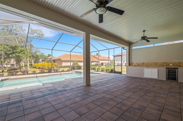 6527 Eagle Ridge Way, Lakeland, FL 33813 - view of patio / terrace with wine cooler, ceiling fan, an outdoor pool, and a lanai