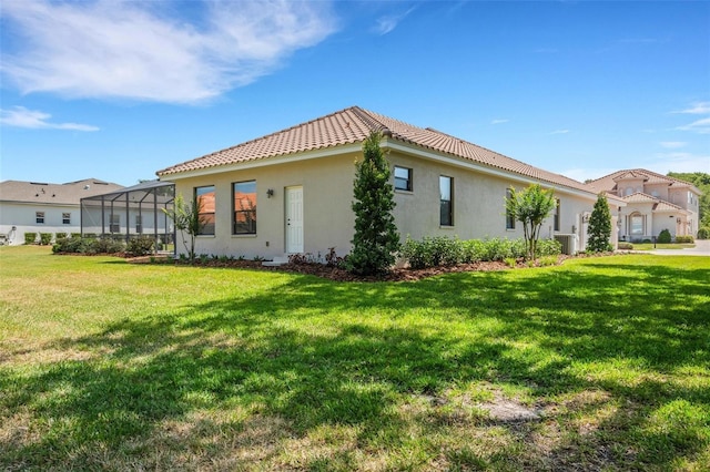 6527 Eagle Ridge Way, Lakeland, FL 33813 - view of front of property with a front yard, a tile roof, and stucco siding