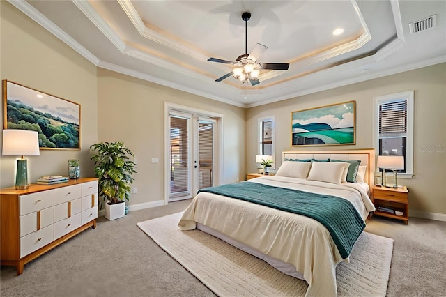 6527 Eagle Ridge Way, Lakeland, FL 33813 - bedroom featuring crown molding, light colored carpet, a tray ceiling, access to exterior, and a ceiling fan