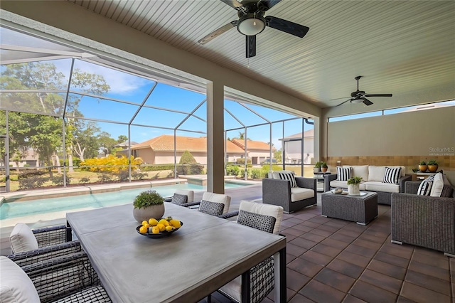 6527 Eagle Ridge Way, Lakeland, FL 33813 - view of patio / terrace featuring outdoor lounge area, a ceiling fan, an outdoor pool, outdoor dining area, and a residential view