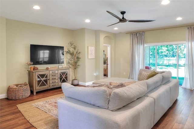 1233 Emerald Hill Way, Valrico, FL 33594 - living area featuring arched walkways, a ceiling fan, recessed lighting, wood finished floors, and baseboards
