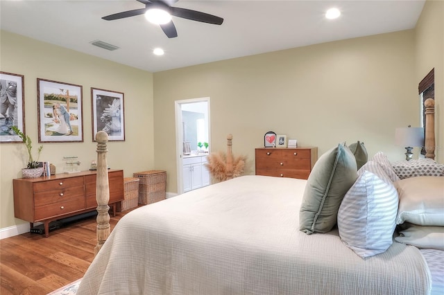 1233 Emerald Hill Way, Valrico, FL 33594 - bedroom with wood finished floors, recessed lighting, ceiling fan, baseboards, and ensuite bath