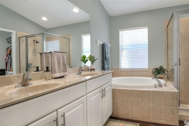 1233 Emerald Hill Way, Valrico, FL 33594 - bathroom featuring double vanity, a shower stall, a bath, tile patterned floors, and recessed lighting