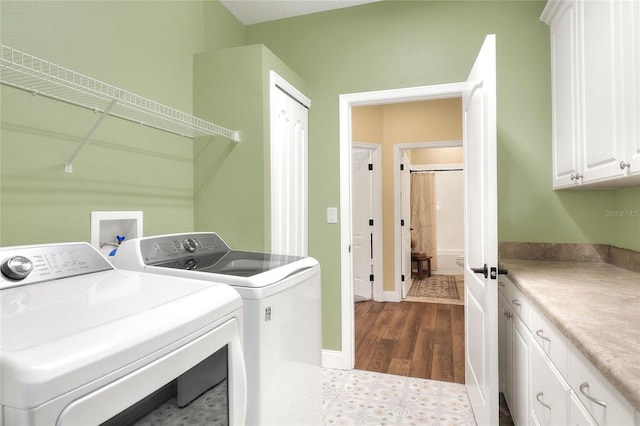 1233 Emerald Hill Way, Valrico, FL 33594 - washroom with cabinet space, washer and dryer, dark wood-style floors, and baseboards