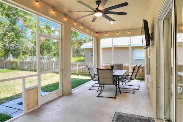 1233 Emerald Hill Way, Valrico, FL 33594 - sunroom featuring ceiling fan, outdoor dining space, and plenty of natural light