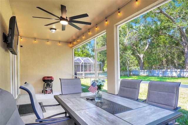 1233 Emerald Hill Way, Valrico, FL 33594 - view of patio / terrace with outdoor dining area, ceiling fan, glass enclosure, and a swimming pool