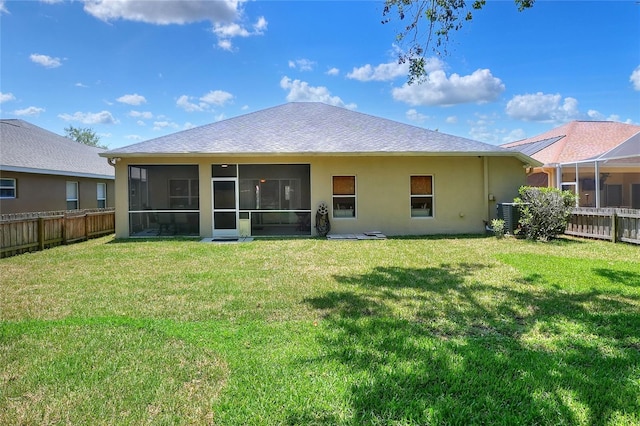 1233 Emerald Hill Way, Valrico, FL 33594 - back of property featuring stucco siding, a sunroom, cooling unit, and a shingled roof