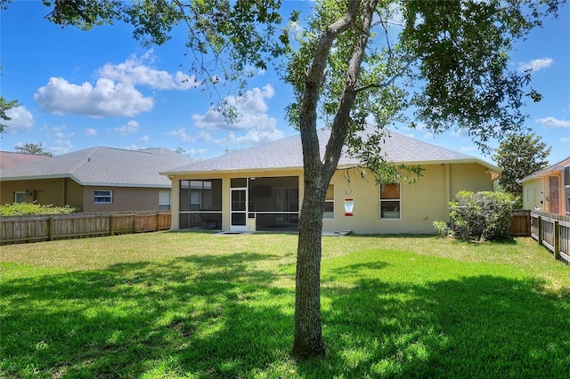 1233 Emerald Hill Way, Valrico, FL 33594 - rear view of property with a sunroom and stucco siding