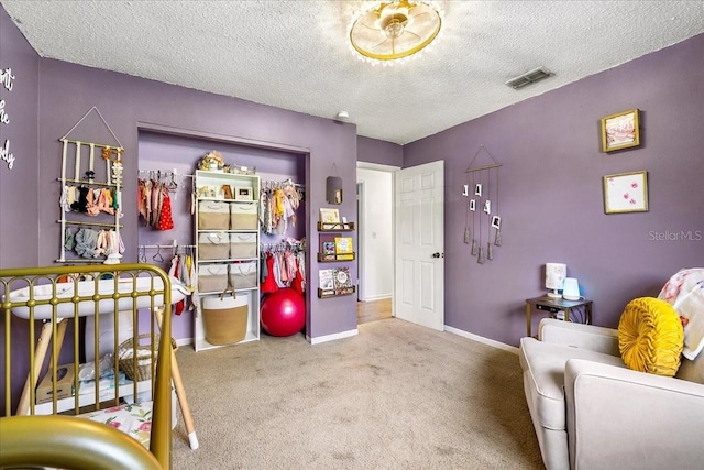 2810 Gary Ln, Lakeland, FL 33812 - bedroom featuring a textured ceiling, baseboards, carpet flooring, and a closet