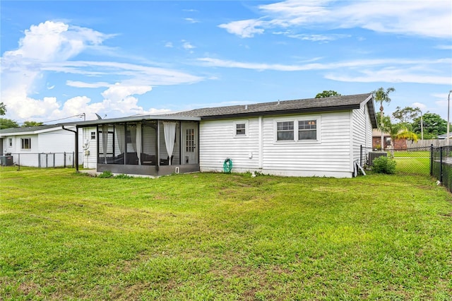2810 Gary Ln, Lakeland, FL 33812 - back of property with a sunroom and central air condition unit