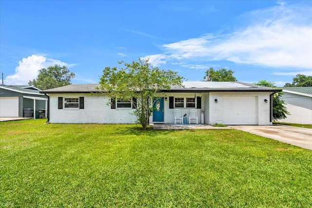 2810 Gary Ln, Lakeland, FL 33812 - ranch-style house featuring driveway, an attached garage, brick siding, a front yard, and a porch