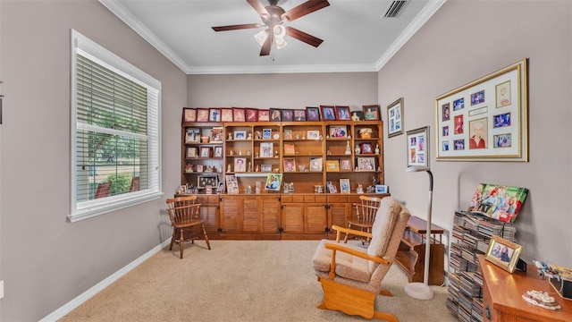 2025 Viewpoint Landings Rd, Lakeland, FL 33810 - sitting room featuring carpet, ceiling fan, ornamental molding, and baseboards