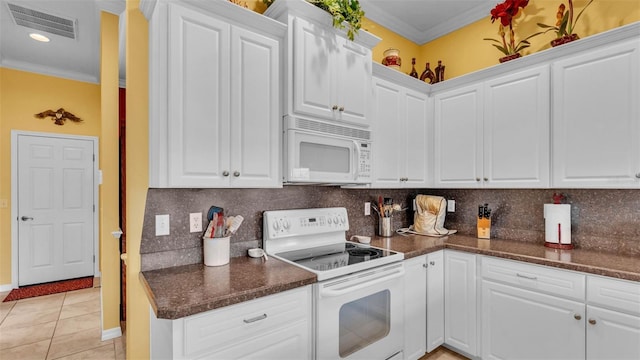 2025 Viewpoint Landings Rd, Lakeland, FL 33810 - kitchen with white appliances, crown molding, tasteful backsplash, white cabinets, and light tile patterned flooring