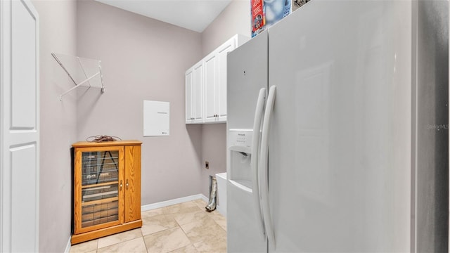 2025 Viewpoint Landings Rd, Lakeland, FL 33810 - laundry area with cabinet space, hookup for an electric dryer, and baseboards