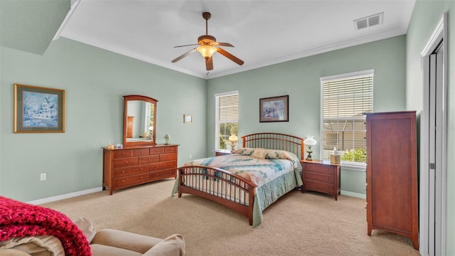 2025 Viewpoint Landings Rd, Lakeland, FL 33810 - bedroom with light colored carpet, baseboards, ornamental molding, and a ceiling fan