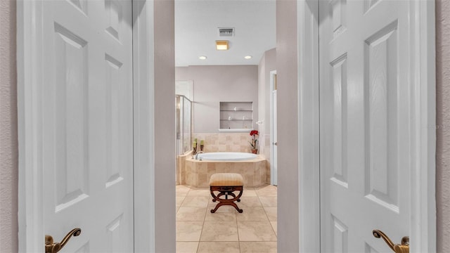 2025 Viewpoint Landings Rd, Lakeland, FL 33810 - bathroom with a garden tub and tile patterned flooring