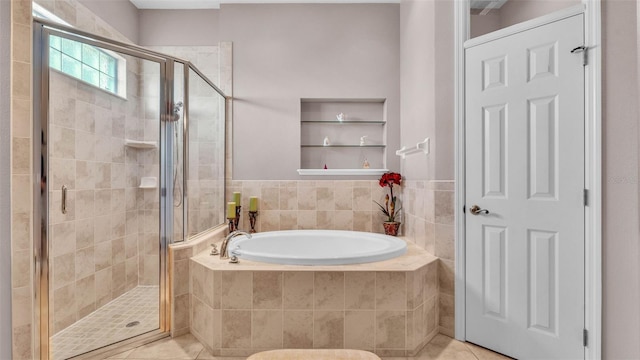 2025 Viewpoint Landings Rd, Lakeland, FL 33810 - full bathroom with a bath, a stall shower, and tile patterned flooring