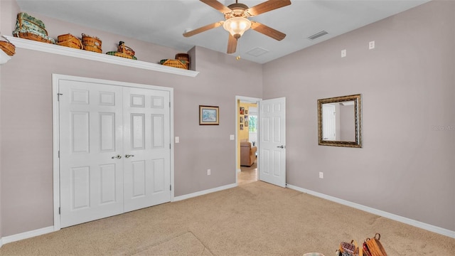 2025 Viewpoint Landings Rd, Lakeland, FL 33810 - unfurnished bedroom with carpet floors, baseboards, a closet, ceiling fan, and vaulted ceiling