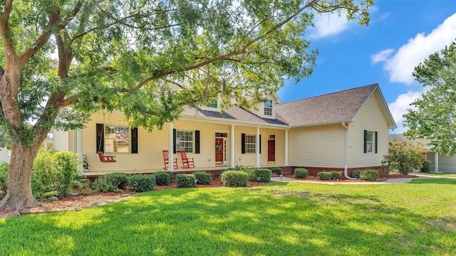 2025 Viewpoint Landings Rd, Lakeland, FL 33810 - view of front of house with a front lawn, covered porch, and roof with shingles