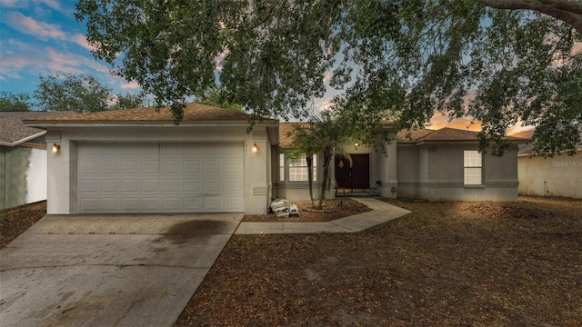 7311 Briarbay Loop, Lakeland, FL 33810 - ranch-style home featuring a garage, driveway, and stucco siding