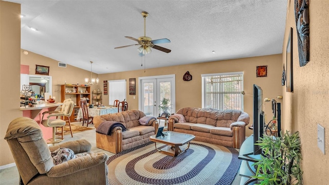 7311 Briarbay Loop, Lakeland, FL 33810 - living area featuring a ceiling fan, lofted ceiling, a chandelier, and a textured ceiling