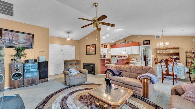 7311 Briarbay Loop, Lakeland, FL 33810 - living room featuring light colored carpet, lofted ceiling, ceiling fan, a chandelier, and baseboards