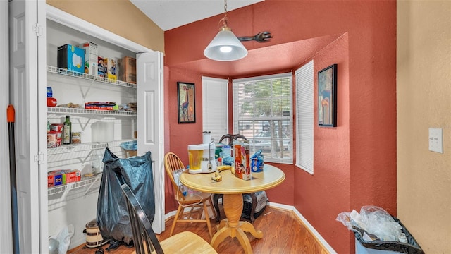 7311 Briarbay Loop, Lakeland, FL 33810 - dining room featuring wood finished floors, baseboards, and a textured wall