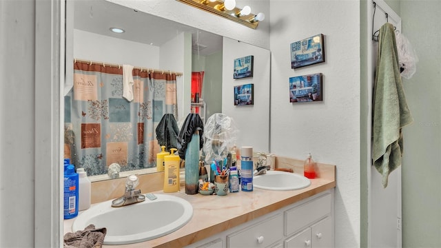 7311 Briarbay Loop, Lakeland, FL 33810 - bathroom featuring double vanity and curtained shower