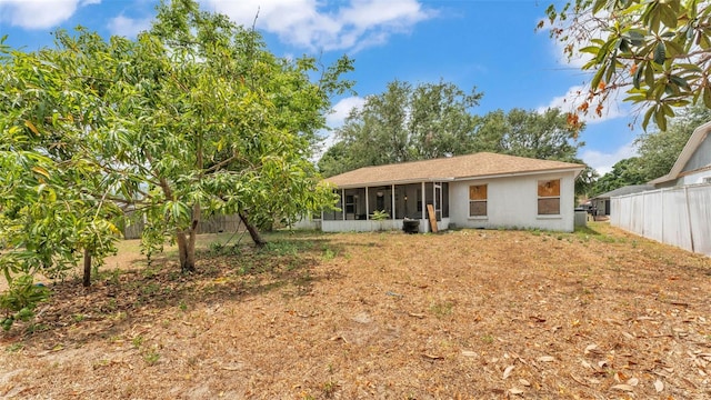 7311 Briarbay Loop, Lakeland, FL 33810 - view of front facade with a sunroom and stucco siding