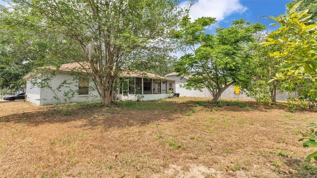 7311 Briarbay Loop, Lakeland, FL 33810 - view of green lawn with a sunroom