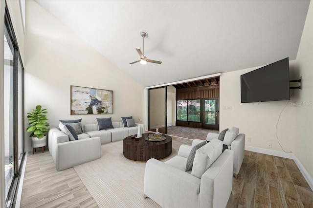 107 Seville Ct N, Plant City, FL 33566 - living area featuring a ceiling fan, wood finished floors, baseboards, and high vaulted ceiling
