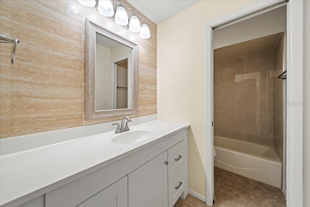 107 Seville Ct N, Plant City, FL 33566 - bathroom with vanity, tile patterned floors, and washtub / shower combination